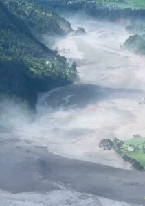 Muddy floodwater rushing through the Bhote Koshi river near Timure, Rasuwa district